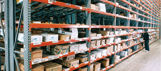 close up of industrial shelving with boxes of inventory