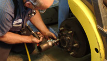 service man repairing wheel