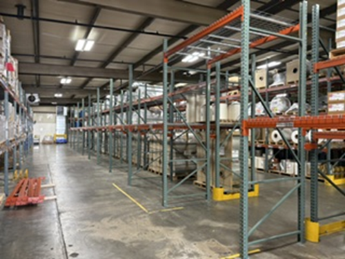 Warehouse aisle with full pallet racking